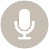 A white microphone icon on a gray square background.
