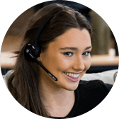Smiling woman wearing a headset, engaging in a conversation.