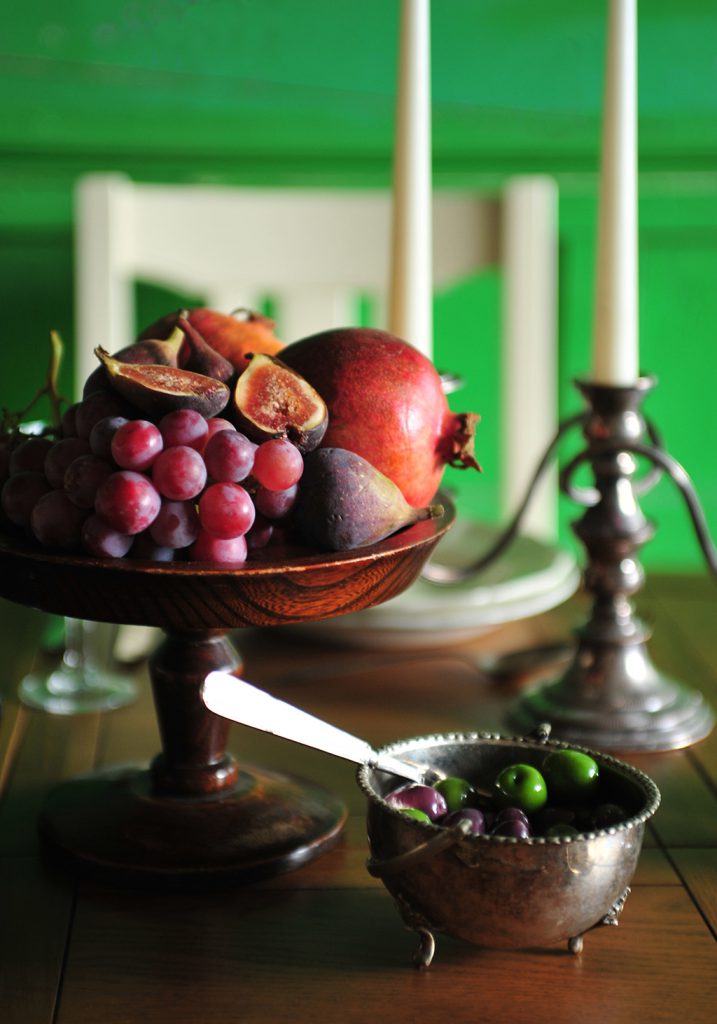 displaying fruit, olives, pomegranites, grapes, figs
