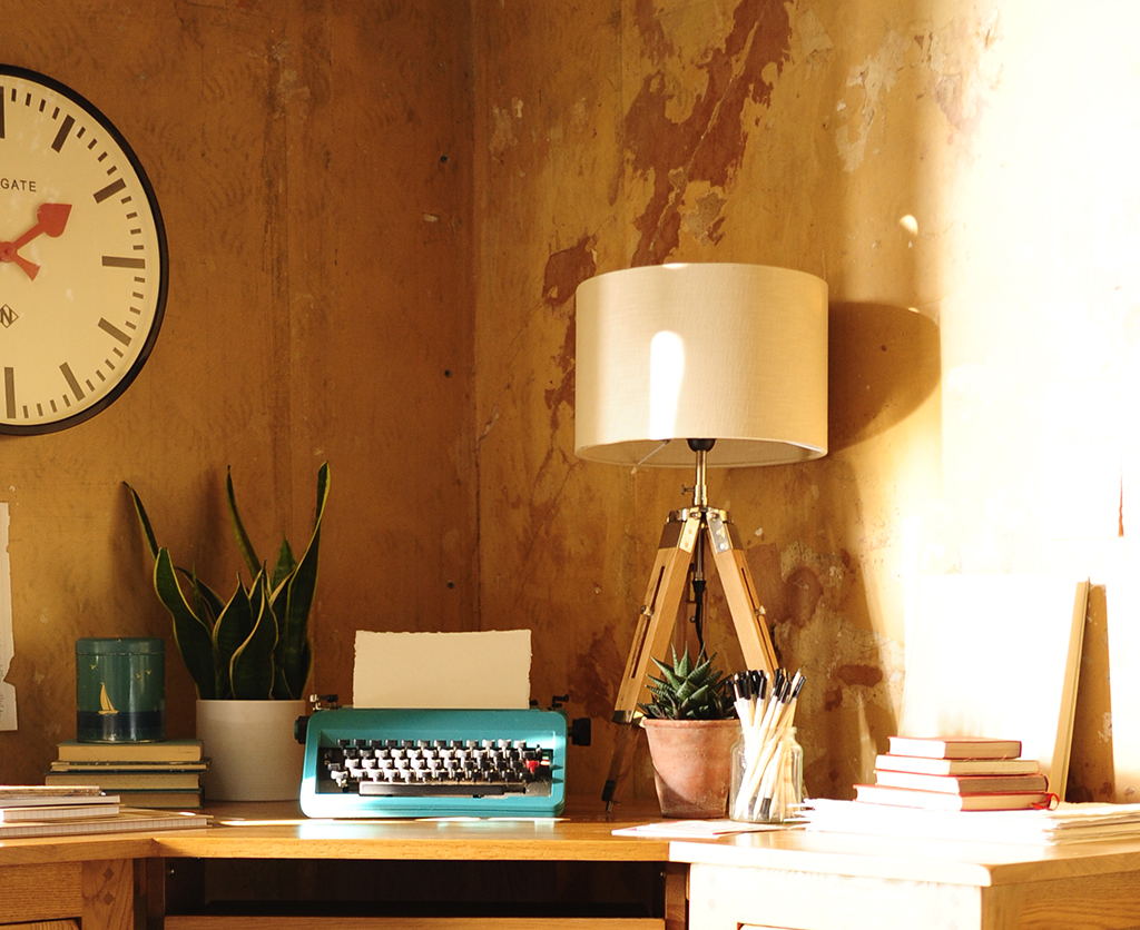 Tripod lamp, typewriter, plant, newgate clock