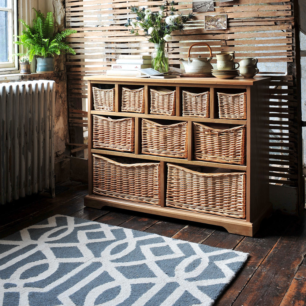 Grey rug, wicker storage, geometric pattern, modern, rustic