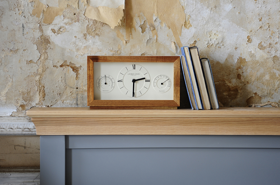 Wooden clock, books, bedroom, grey bed, vintage wall paper2