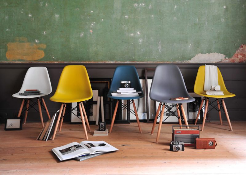 Eames style chairs, group of chairs, wooden floor, green wall, vintage cameras, vintage radios