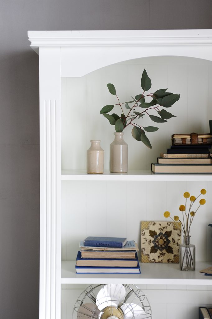 bookcase-beauty-eucalyptus-craspedia-vintage-tiles-vintage-bookswhite-bookcase