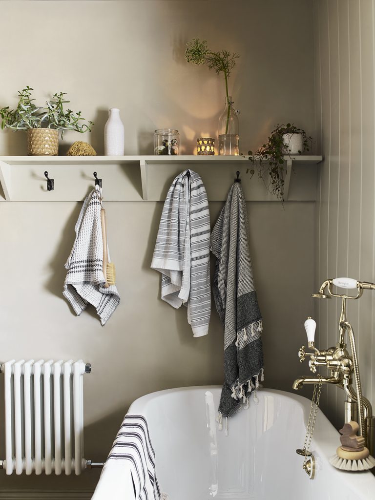 how to be more hygge, beautiful bathroom, bath spa, towels, candles, soft lighting, plants, cosy, self care