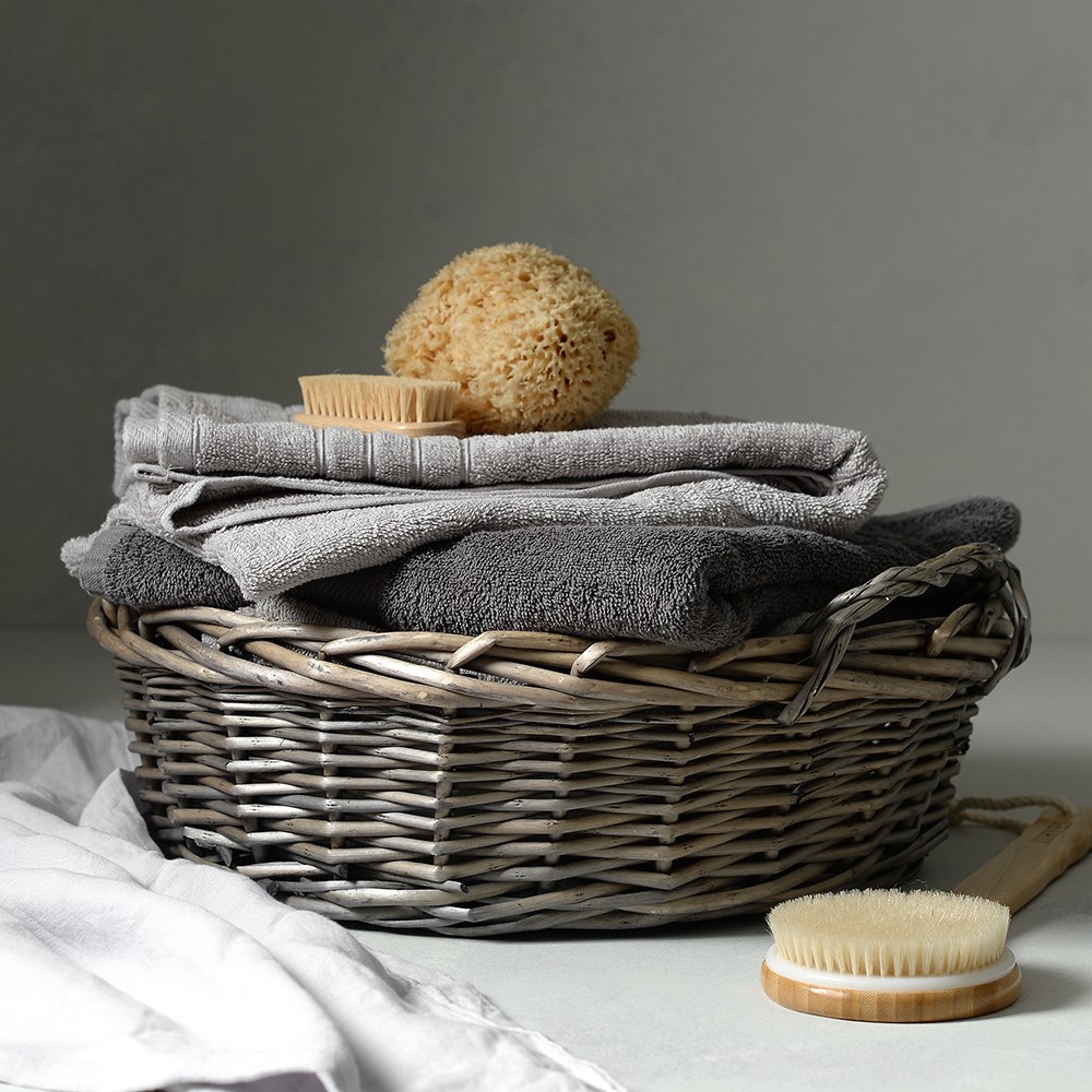woven storage basket, bathroom storage, sponge, towels, spa experience at home
